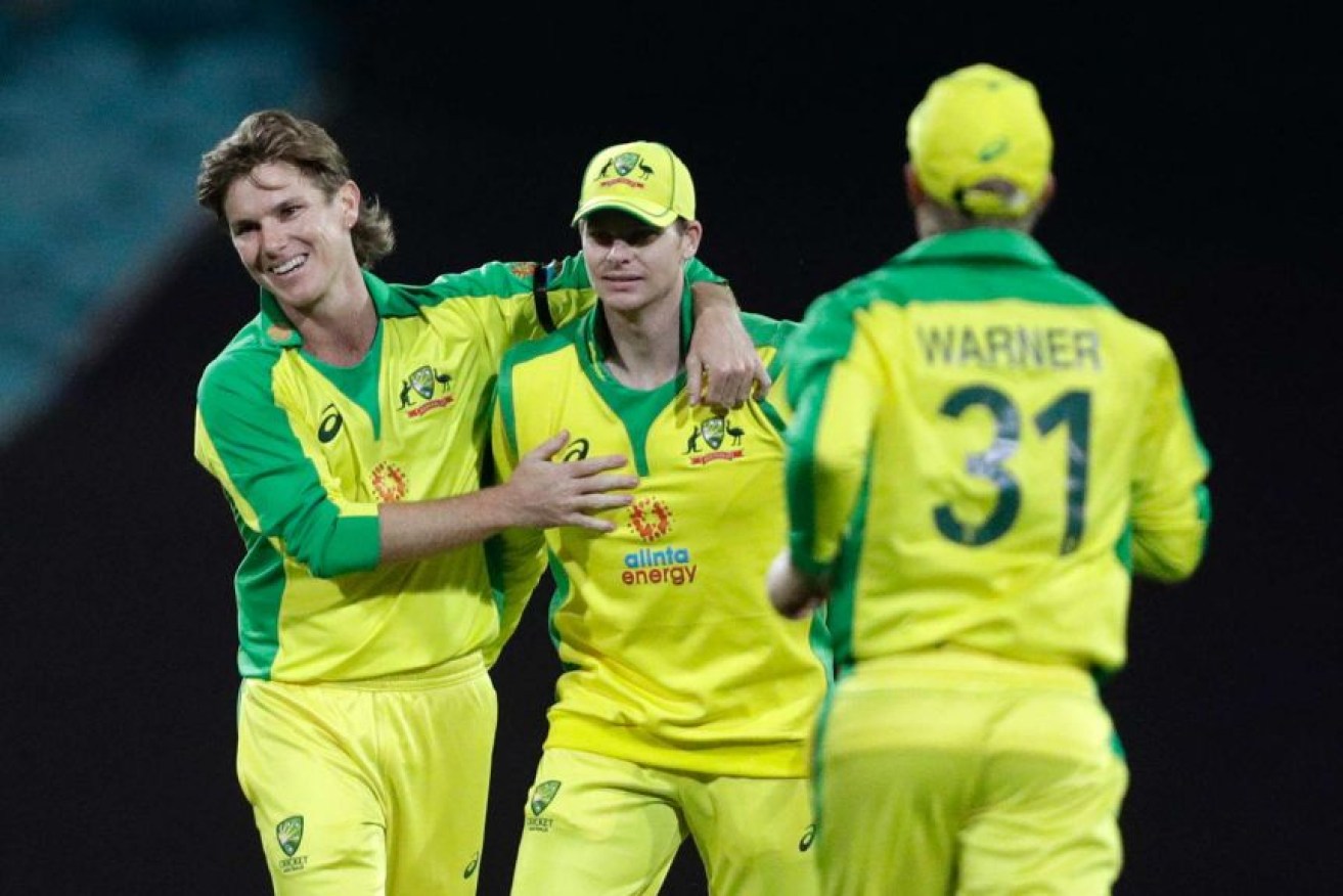 Adam Zampa (left) starred with 4-54 in Australia's win over India, but he said slow over rates were a bad look for cricket.