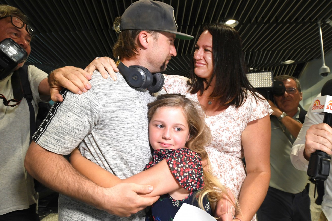 Matt Jacovi re-unites with his wife Ashley and daughter Payten after arriving in Brisbane from Sydney.
