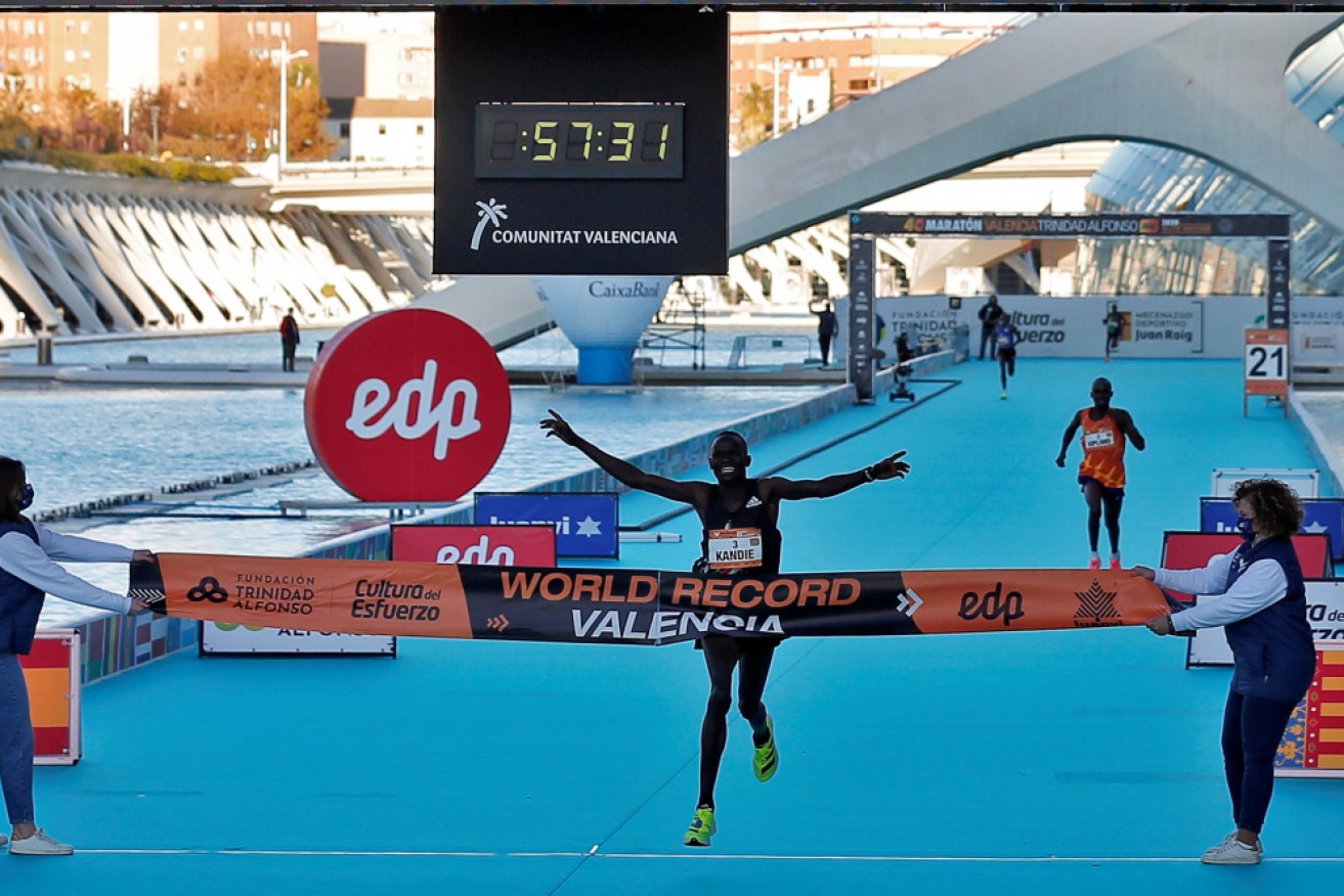 Kibiwott Kandie crosses the finish line to break the world record at the Valencia Half Marathon on Sunday.
