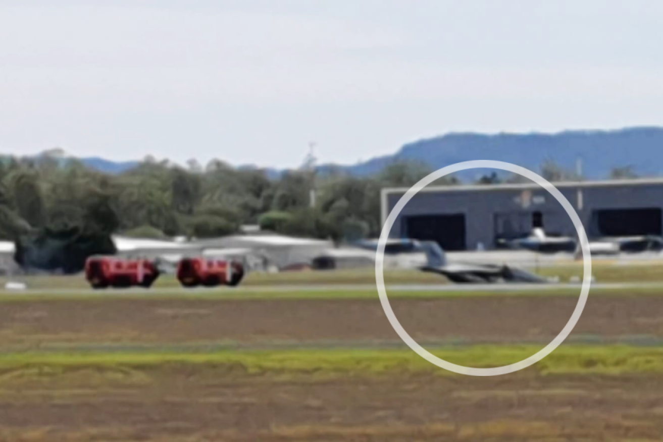 The RAAF Super Hornet (circled) on the runway at RAAF base Amberley on Tuesday.