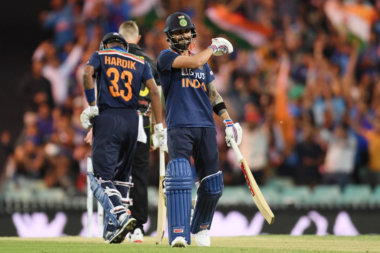 Virat Kohli enjoys hitting a six in the third T20 match at the SCG on Tuesday.