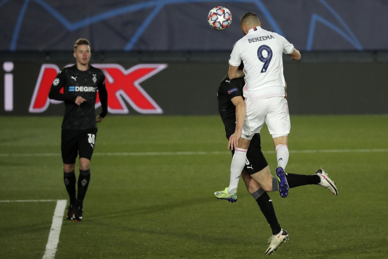 Real Madrid's Karim Benzema scored twice to help his side qualify for the last 16.