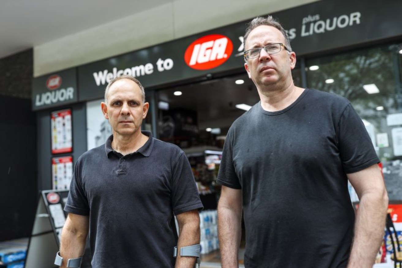 Scott Hill and Ward Mellick are preparing to vacate their supermarket due to safety concerns.