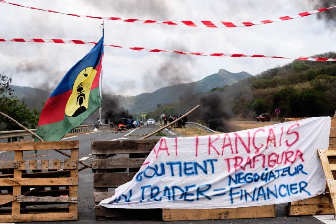 Independent Kanak flags were placed on a roadblock outside of Noumea. 
