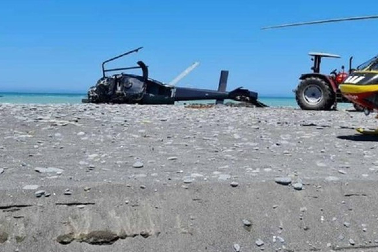 The downed helicopter on the beach after Tuesday's horror crash.