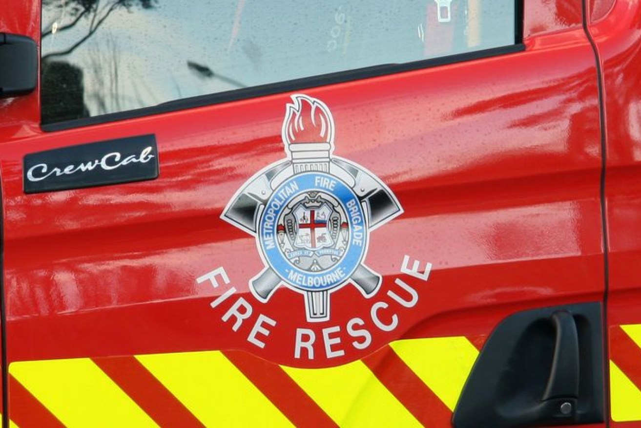 A woman has died in a house fire in Melbourne, with two children critical in hospital.