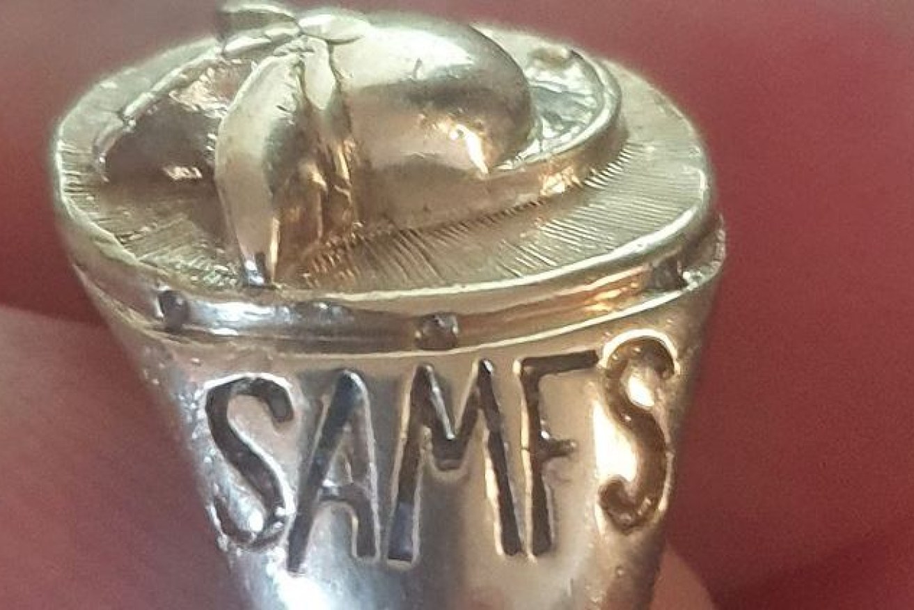 The unique ring with a firefighter's helmet on it and the acronym SAMFS.