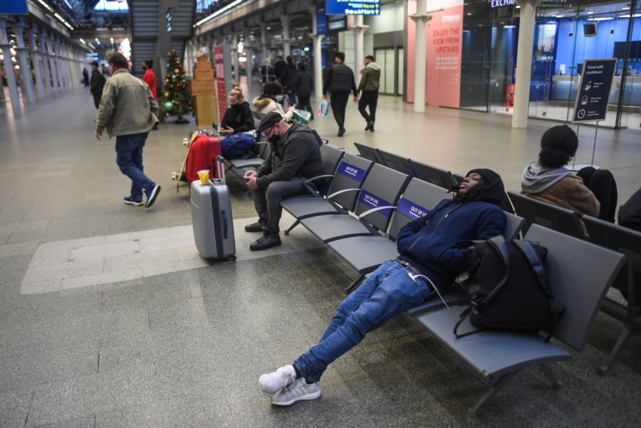 Weary travellers at London's St Pancras station amid the growing travel bans.