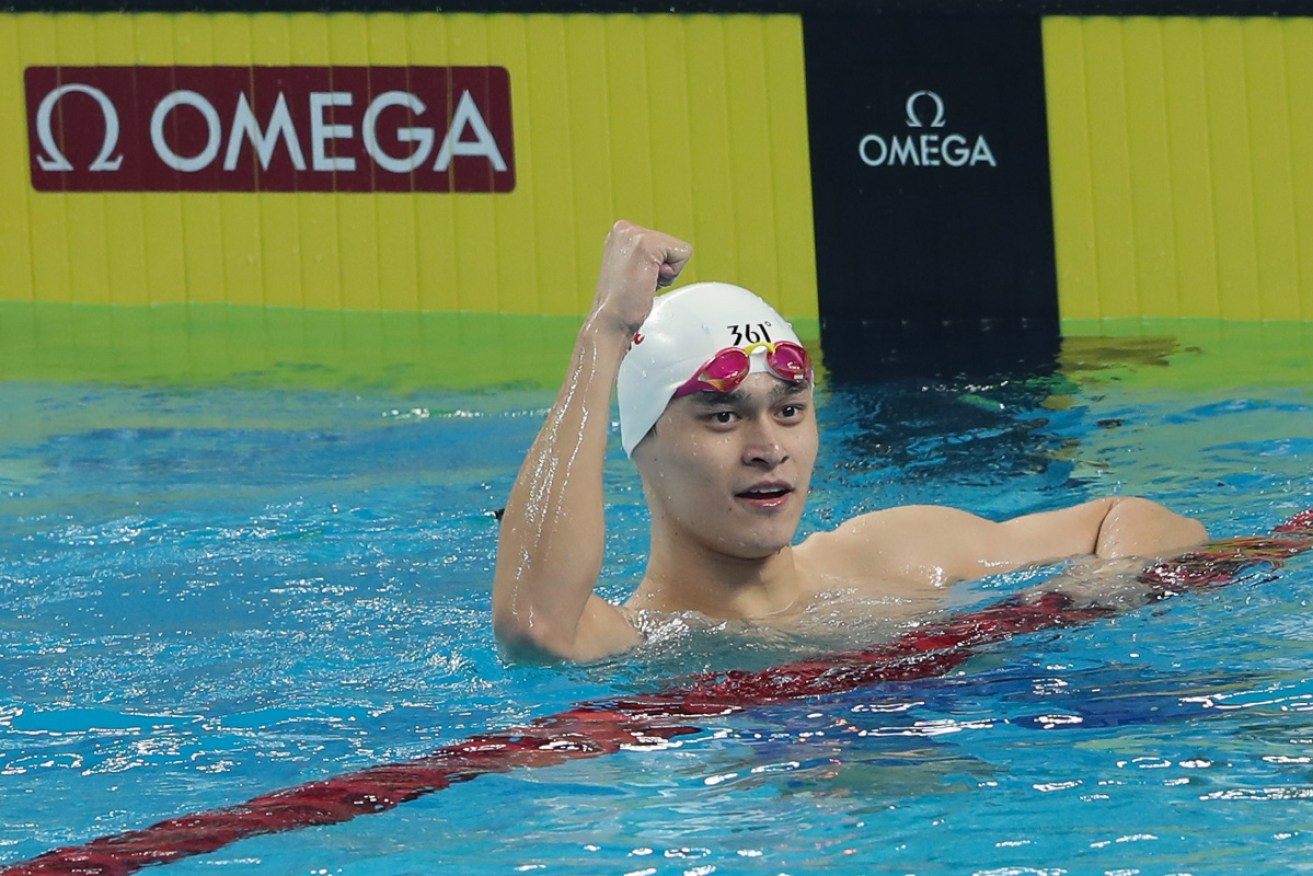 Sun Yang celebrates winning a gold medal during the FINA Champions Swim Series 2020. 