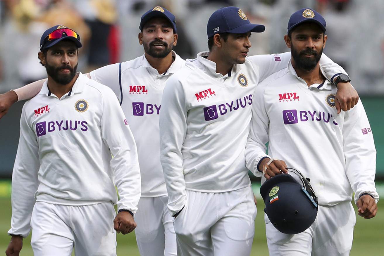 Indian players walk off the MCG at stumps on the third day, with victory in sight.  