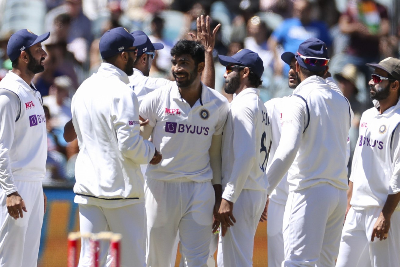 The Indian players celebrate at the MCG.