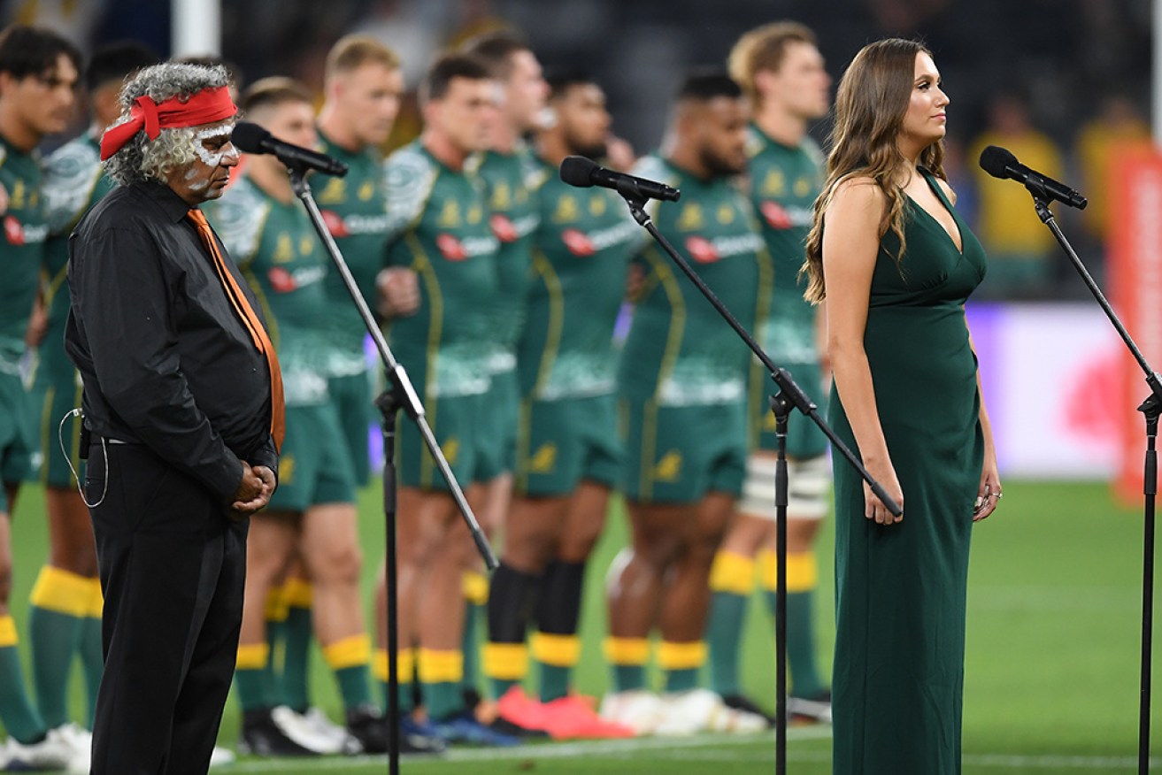 Indigenous woman Olivia Fox sings <i>Advance Australia Fair</I> in the traditional Eora language in Sydney in December. 