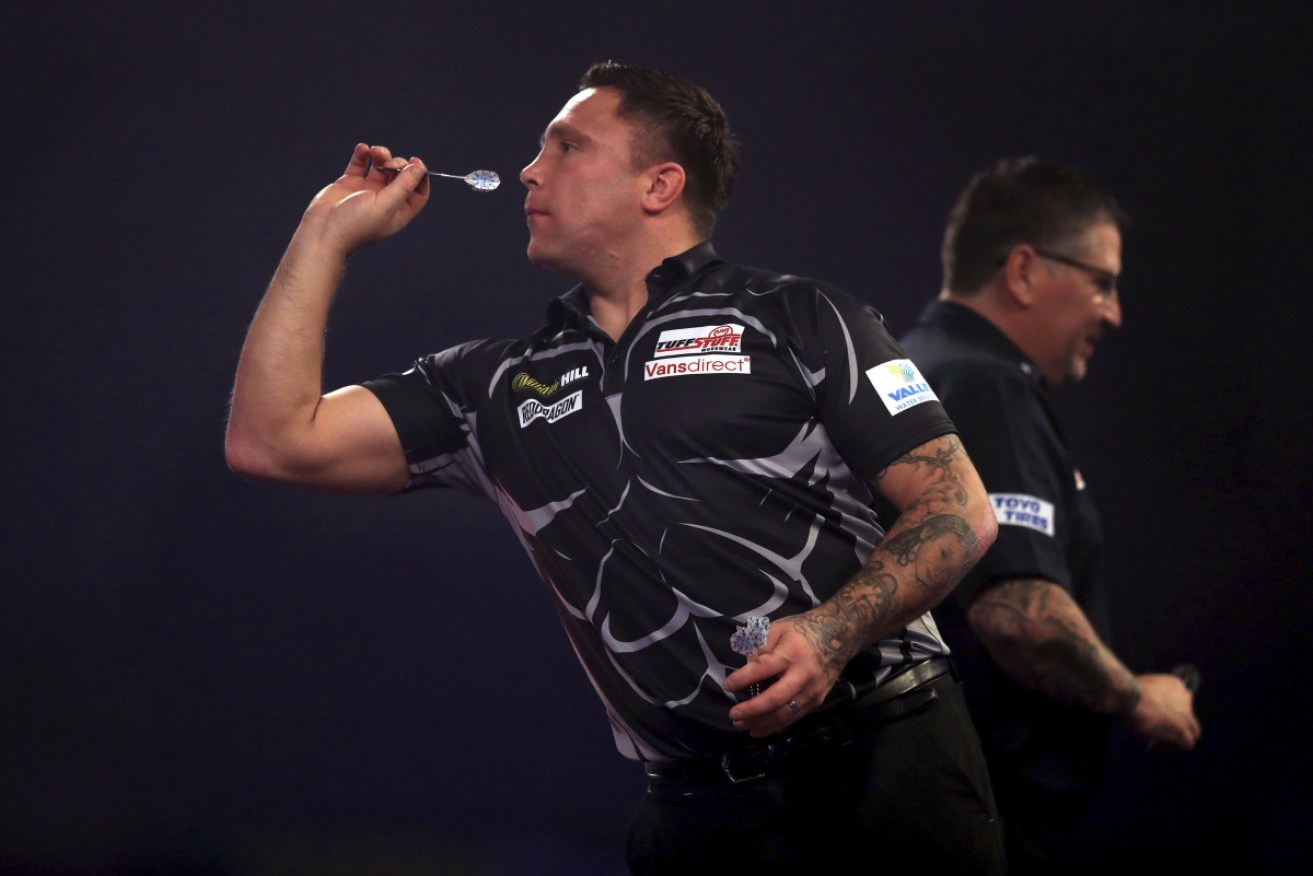 Gerwyn Price in action during the final against Gary Anderson in London. 