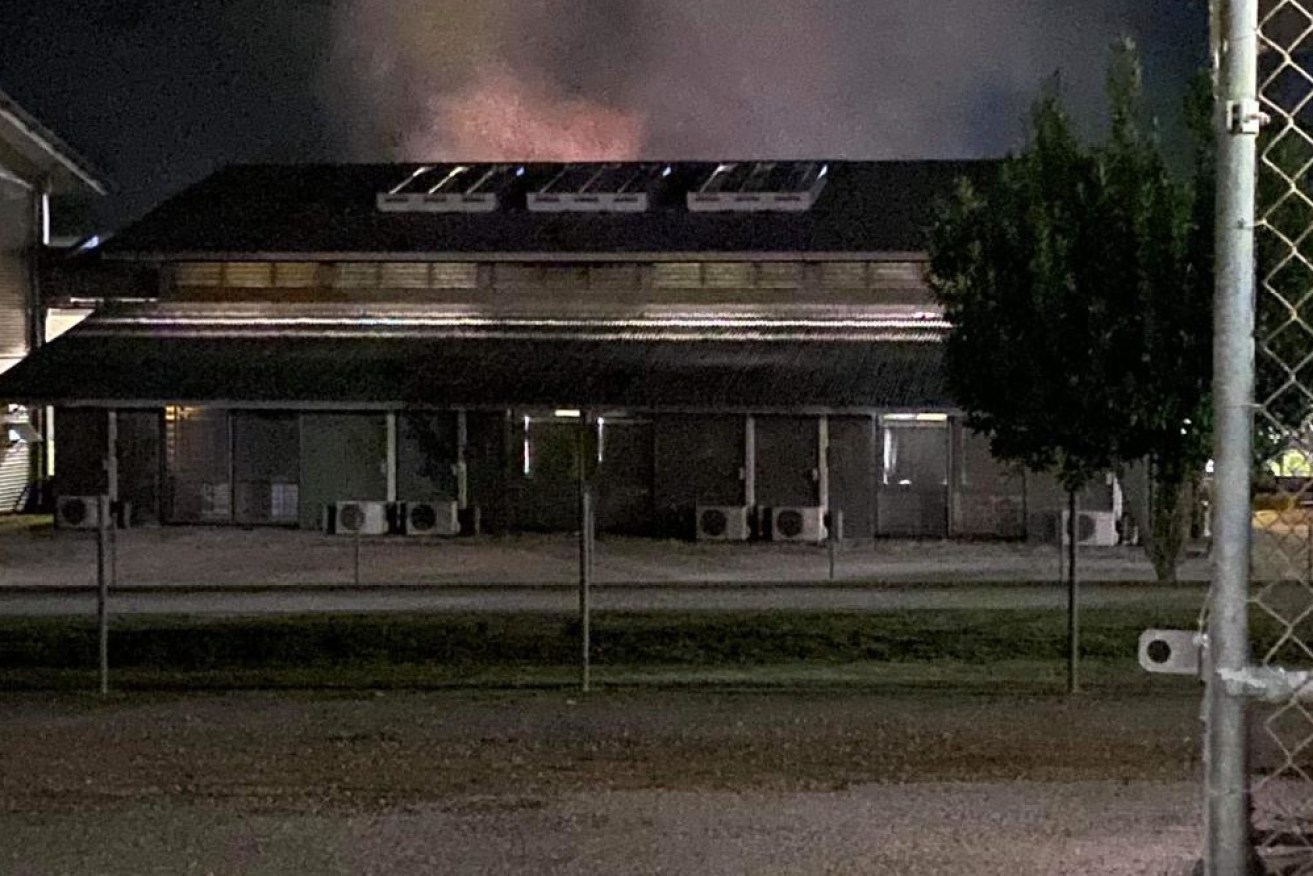 Buildings have been set alight at Christmas Island's detention centre overnight and detainees have scaled the roofs, refugee advocates say.