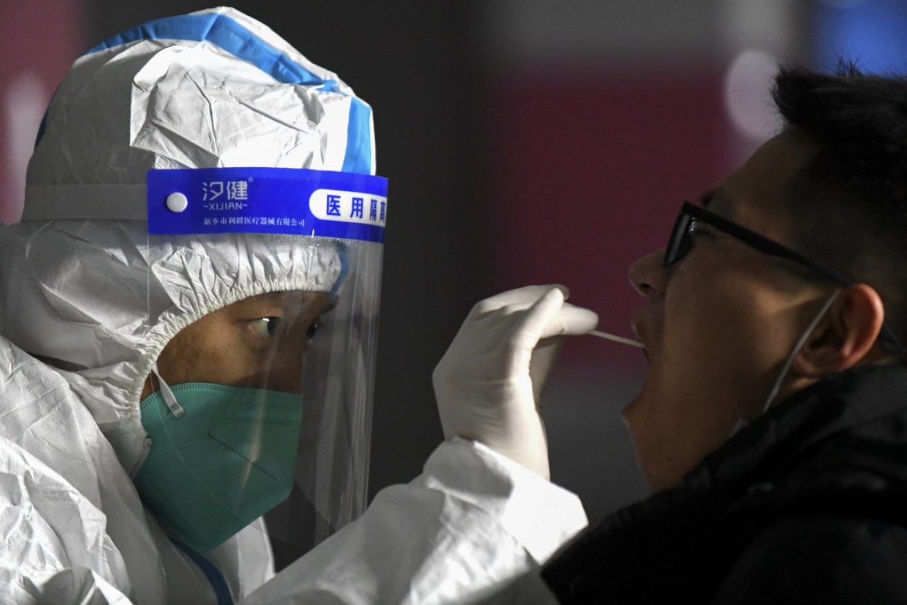 Medical staff take a swab from a resident at a Shijiazhuang community centre on Wednesday. 