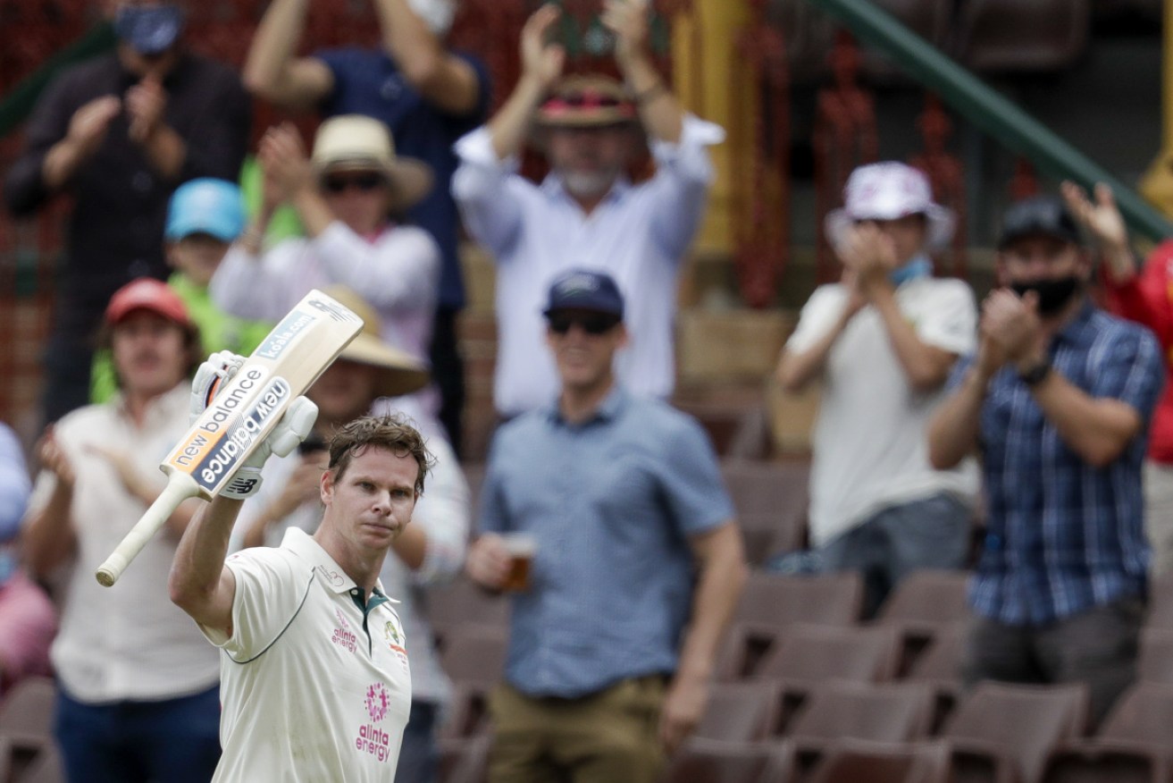 Steve Smith waves to the crowd as he walks from the field after he was run out for 131.