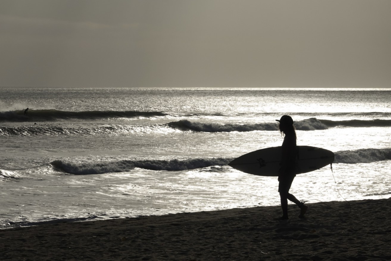 Bali’s surf beaches, such as Kuta in July, attract many foreigners and locals. 