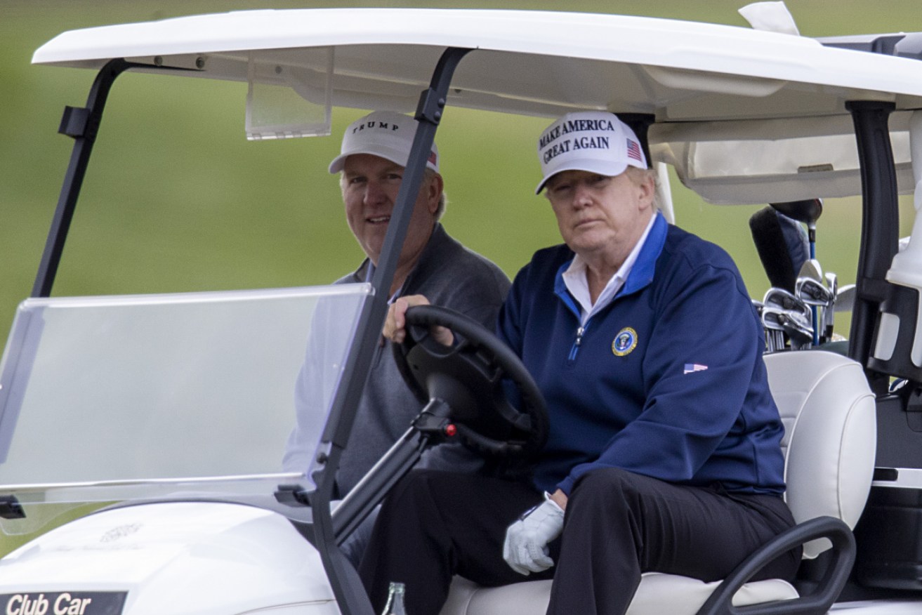 Mr Trump golfing in Virginia, days after the November 3 presidential election.