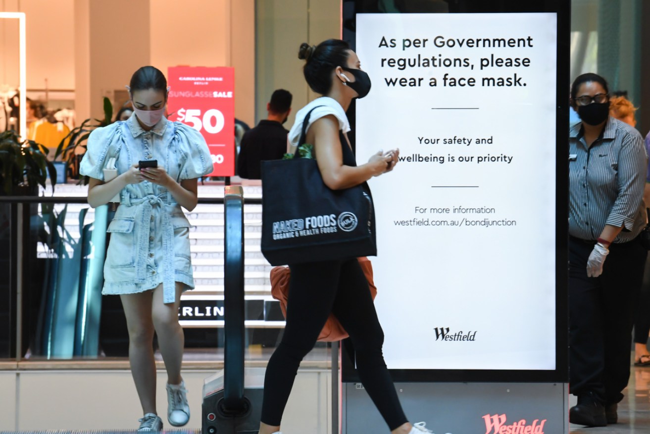 Shoppers wear masks at Sydney's Westfield Bondi.