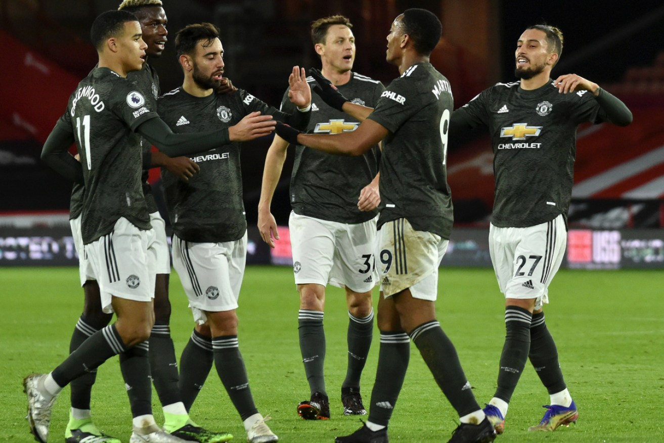 Manchester United players show off the type of celebrations that have earned them the official rebuke.