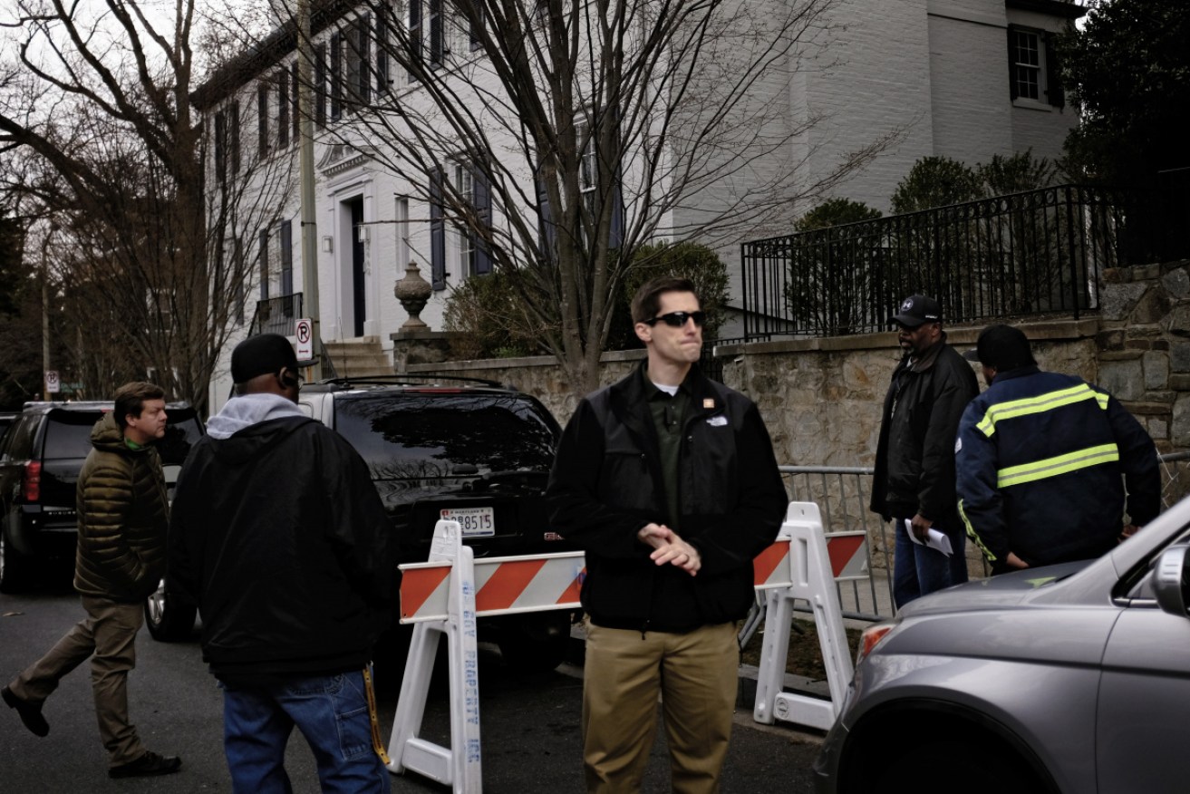 Agents and other US government workers outside the couple's Kalorama home as they prepared to move in in March 2017.