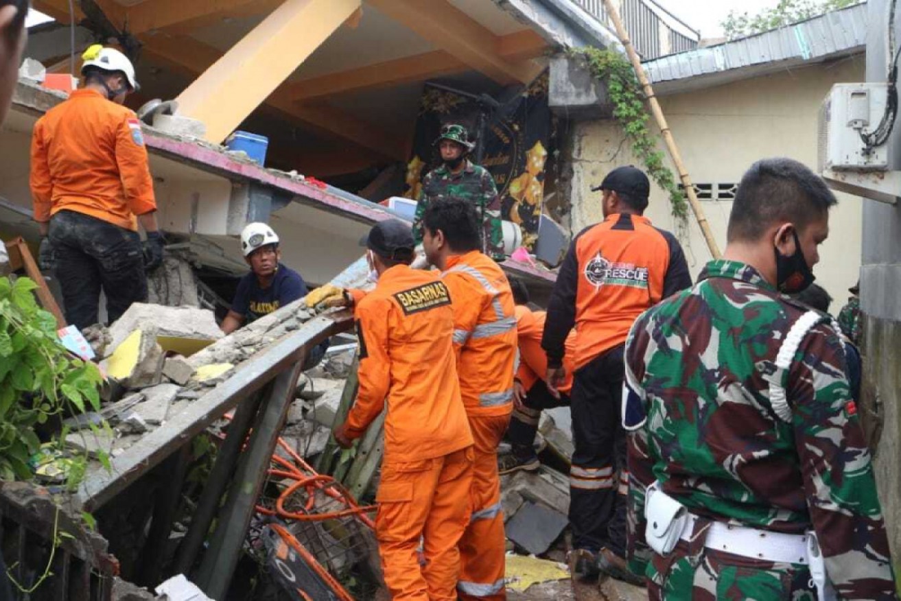Rescue teams search for survivors after the West Sulawesi quake.