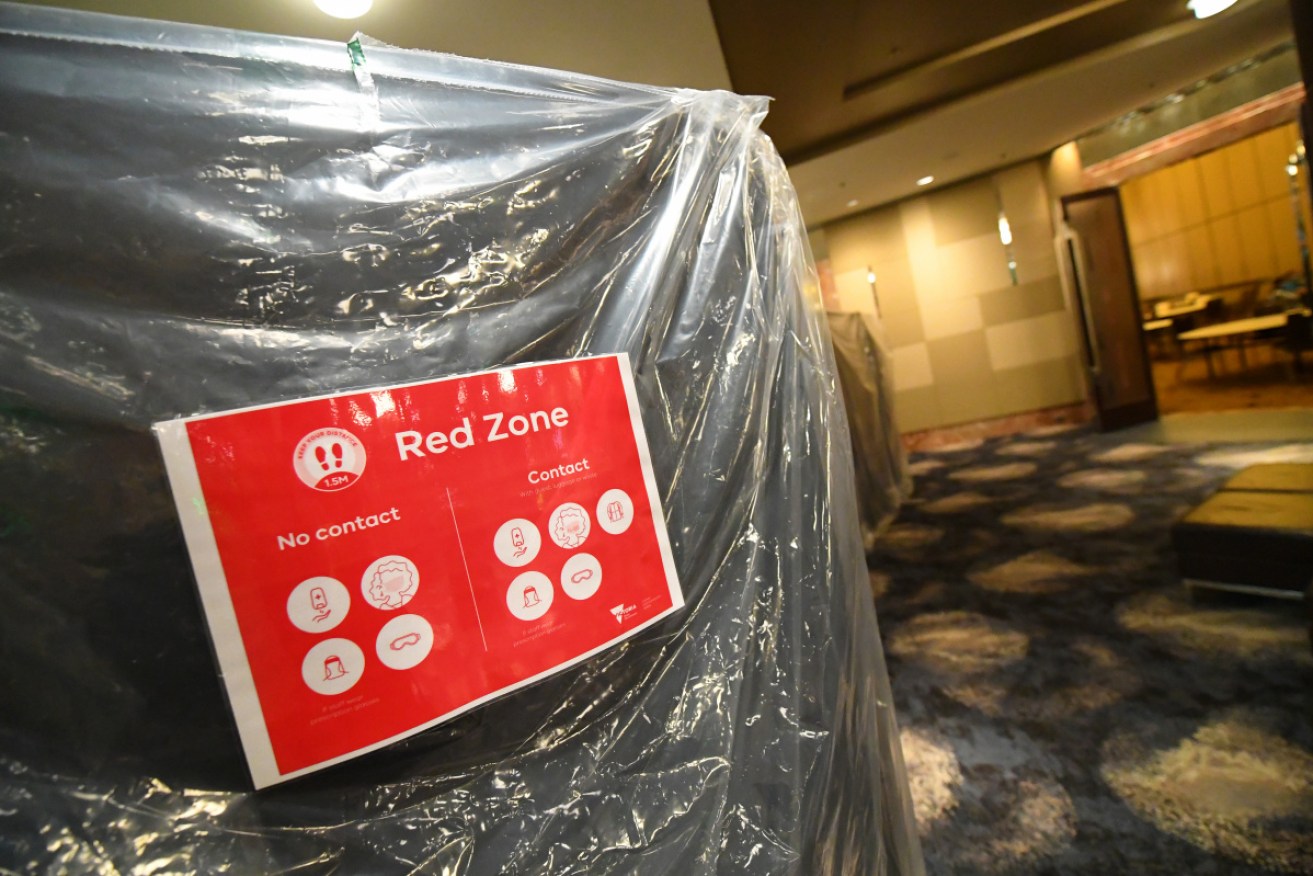 Signage for the 'Red Zone' is seen inside of the Grand Hyatt hotel in Melbourne.