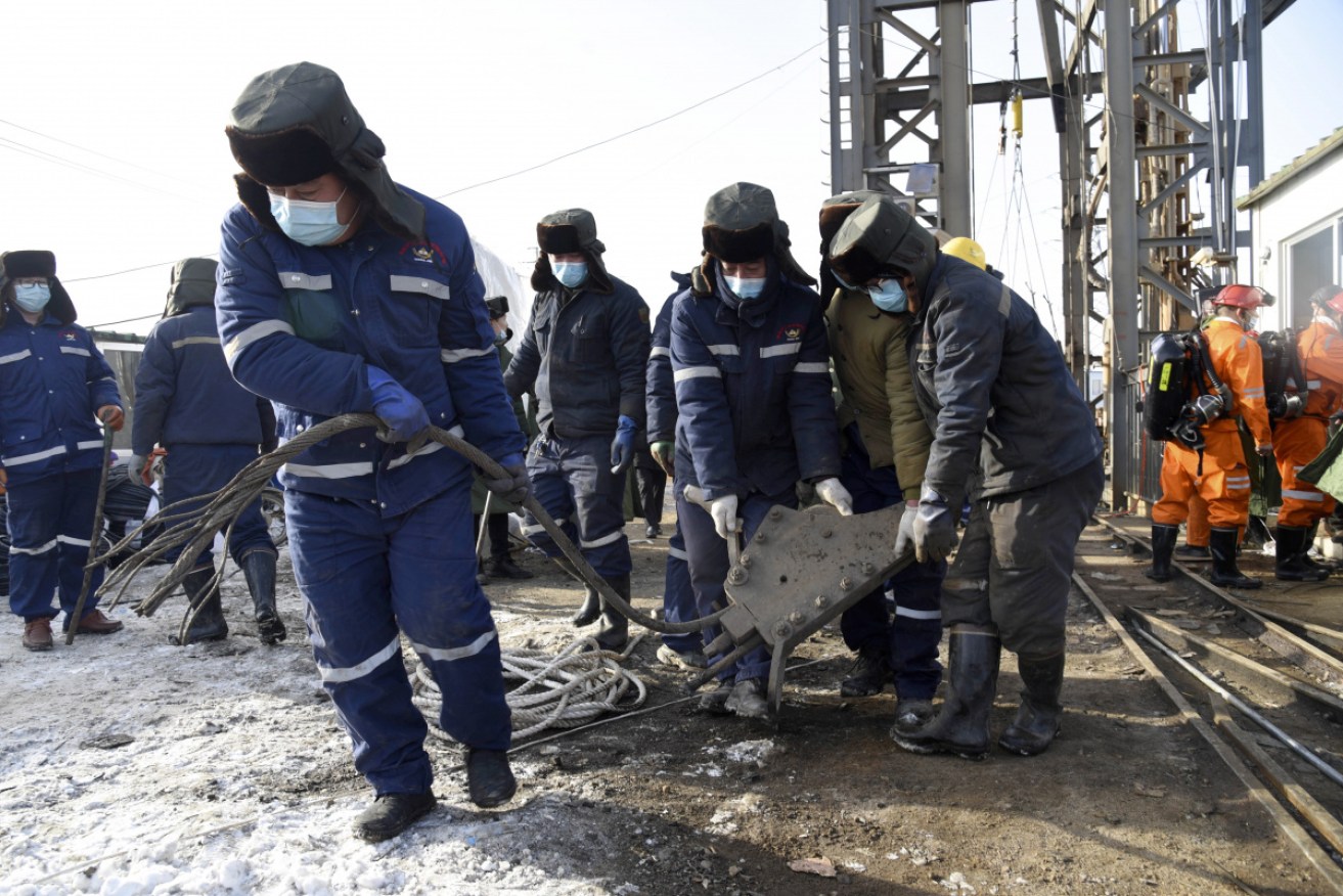 Rescuers work at the site of the gold mine explosion in Qixia in eastern China's Shandong Province.
