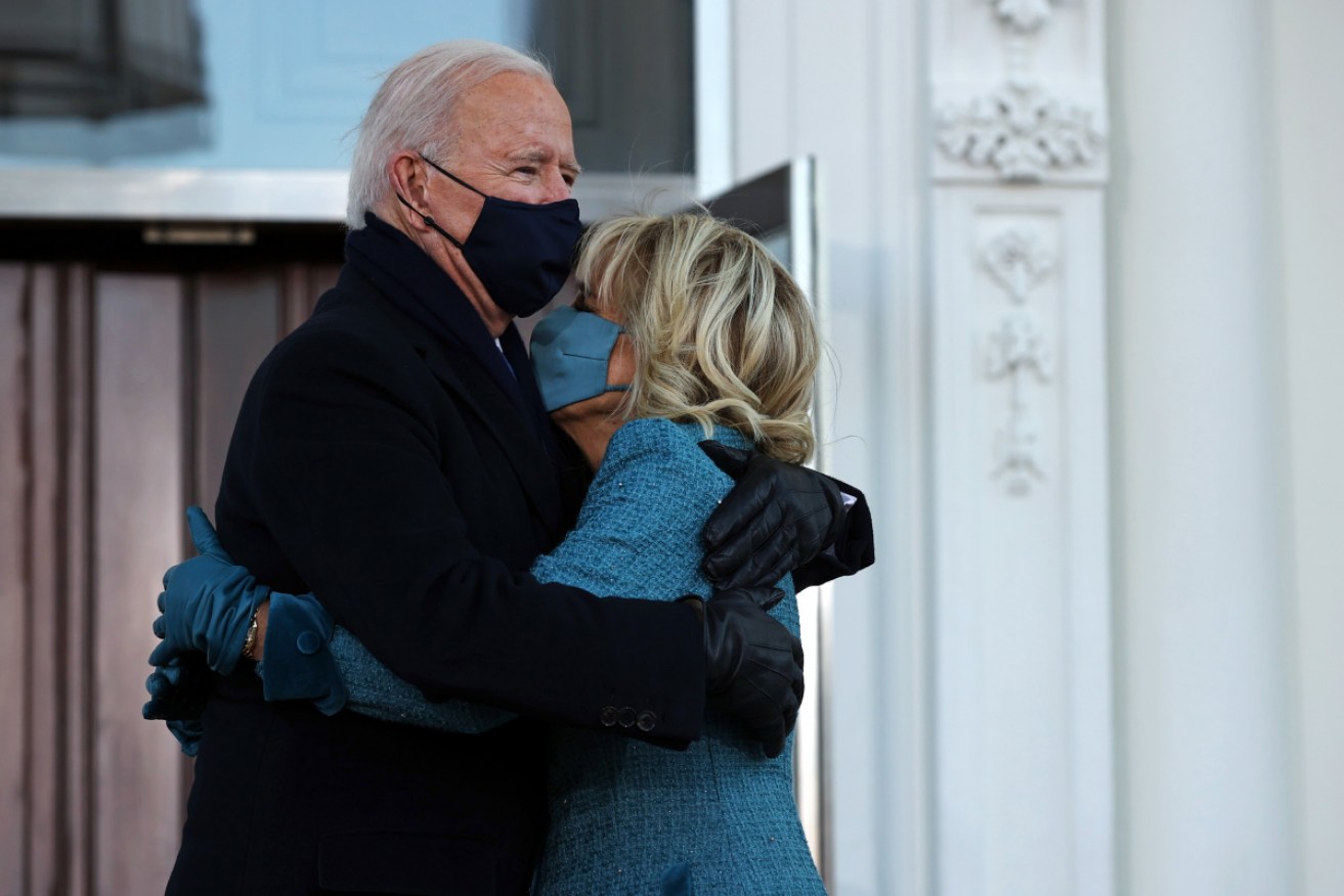 Joe Biden embraces the First Lady Dr Jill Biden at the White House after his inauguration. 