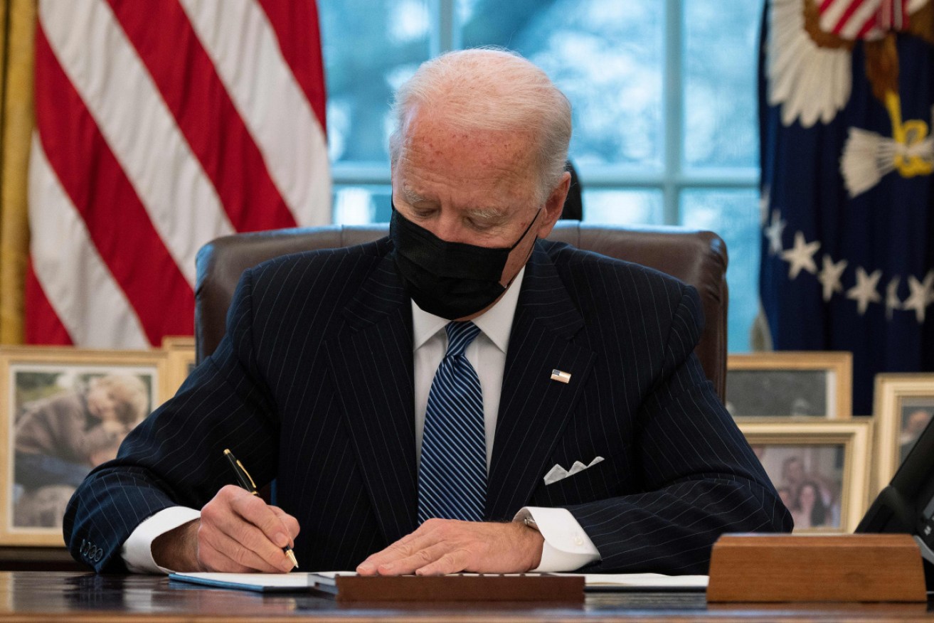 Joe Biden signs an Executive Order at the White House on Monday reversing Trump era ban on Transgender people serving in the military.
