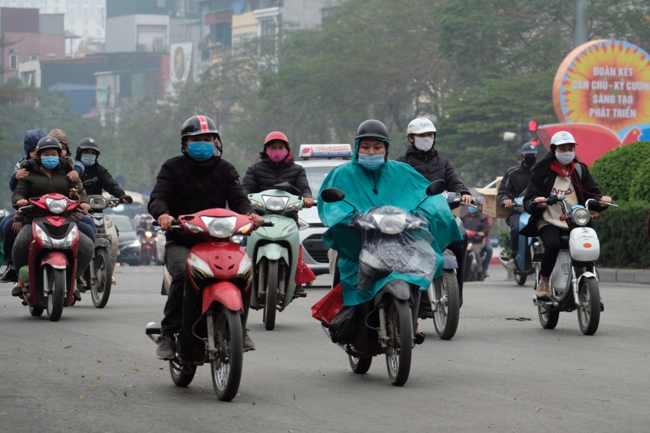 Masks were the norm in Vietnam during the first year of the pandemic, but the latest and more virulent strain is defeating all efforts to foil its spread.
