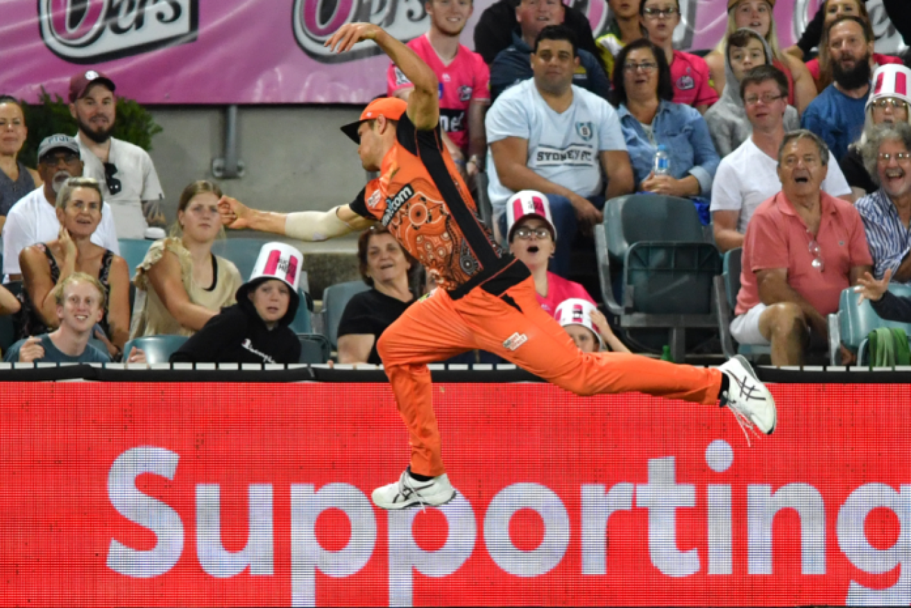 The Scorchers' Aaron Hardie flies and tries but can't stop another Sixers six.