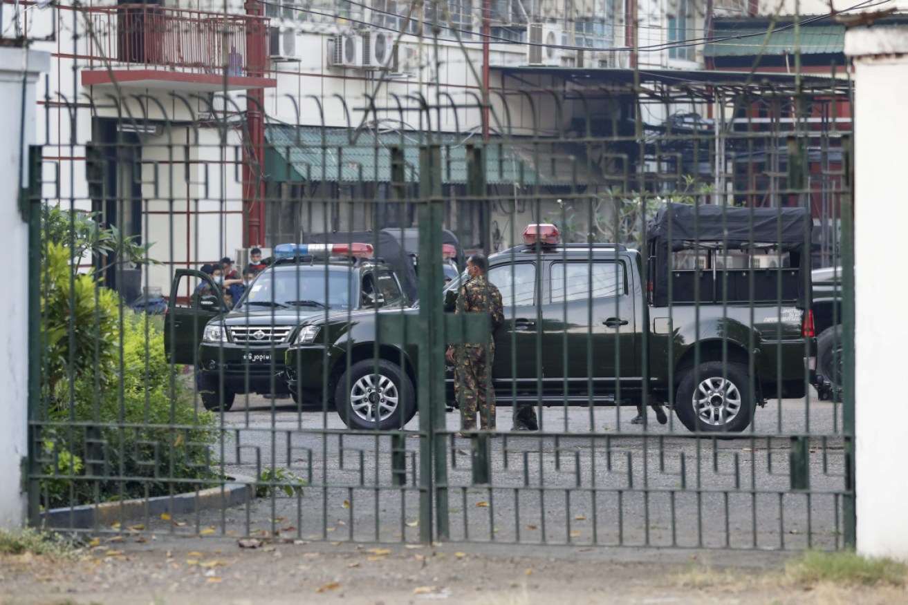 Military soldiers and vehicles inside the state-run Myanmar Radio and Television office compound, in Yangon, Myanmar, on Monday.