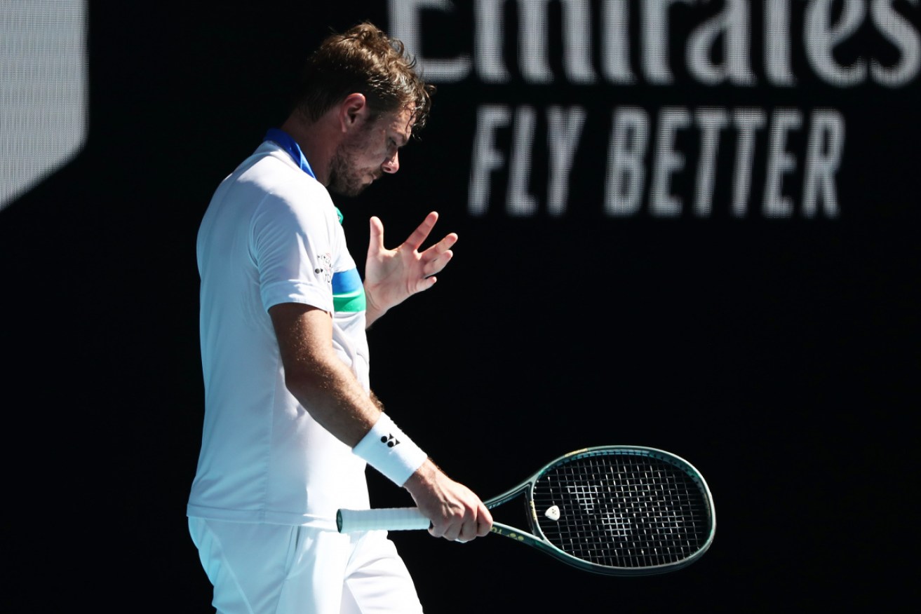 Stan Wawrinka cuts a dark figure as he makes his exit from Melbourne Park.