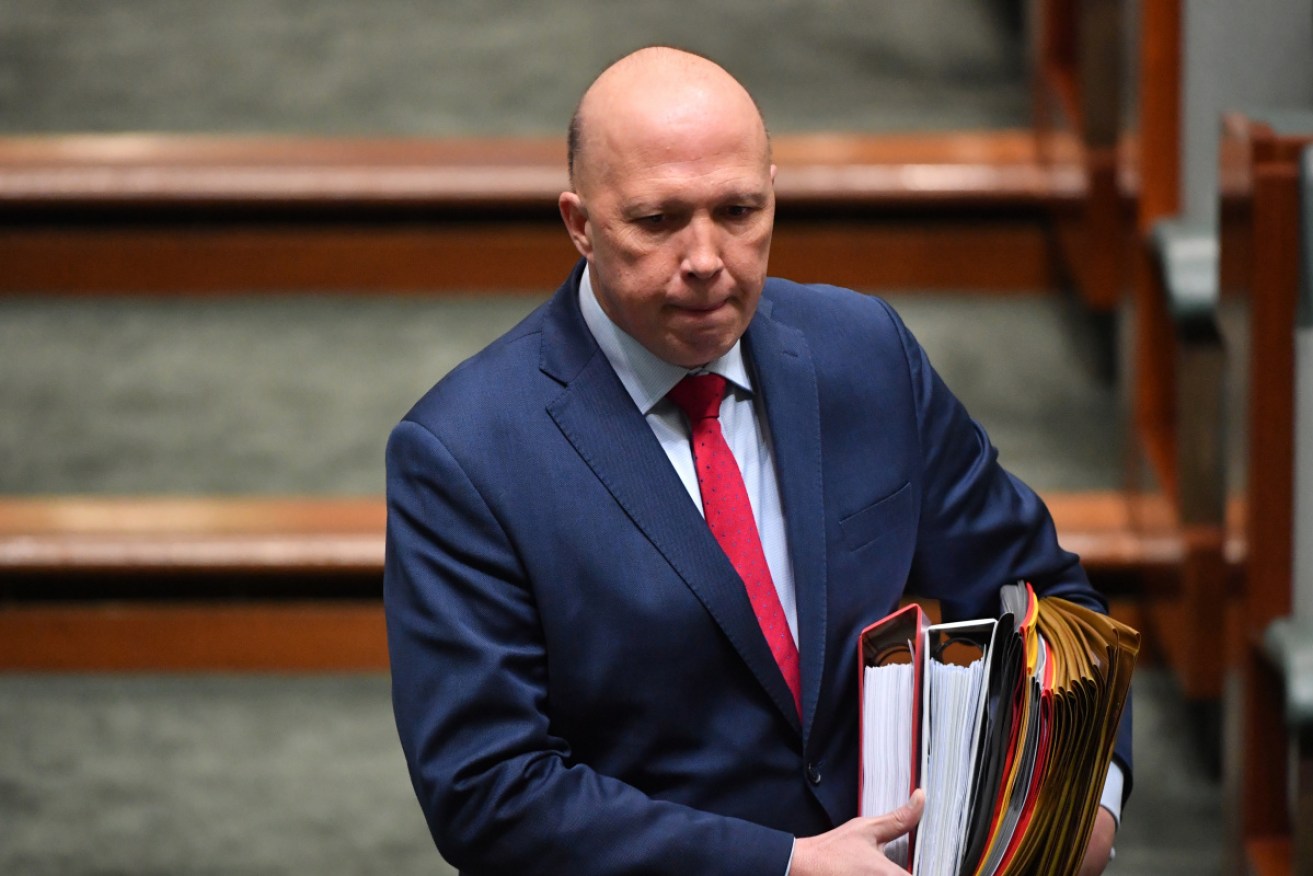 An ABC investigation has found Mr Dutton overruled his department in relation to millions of dollars in grants.