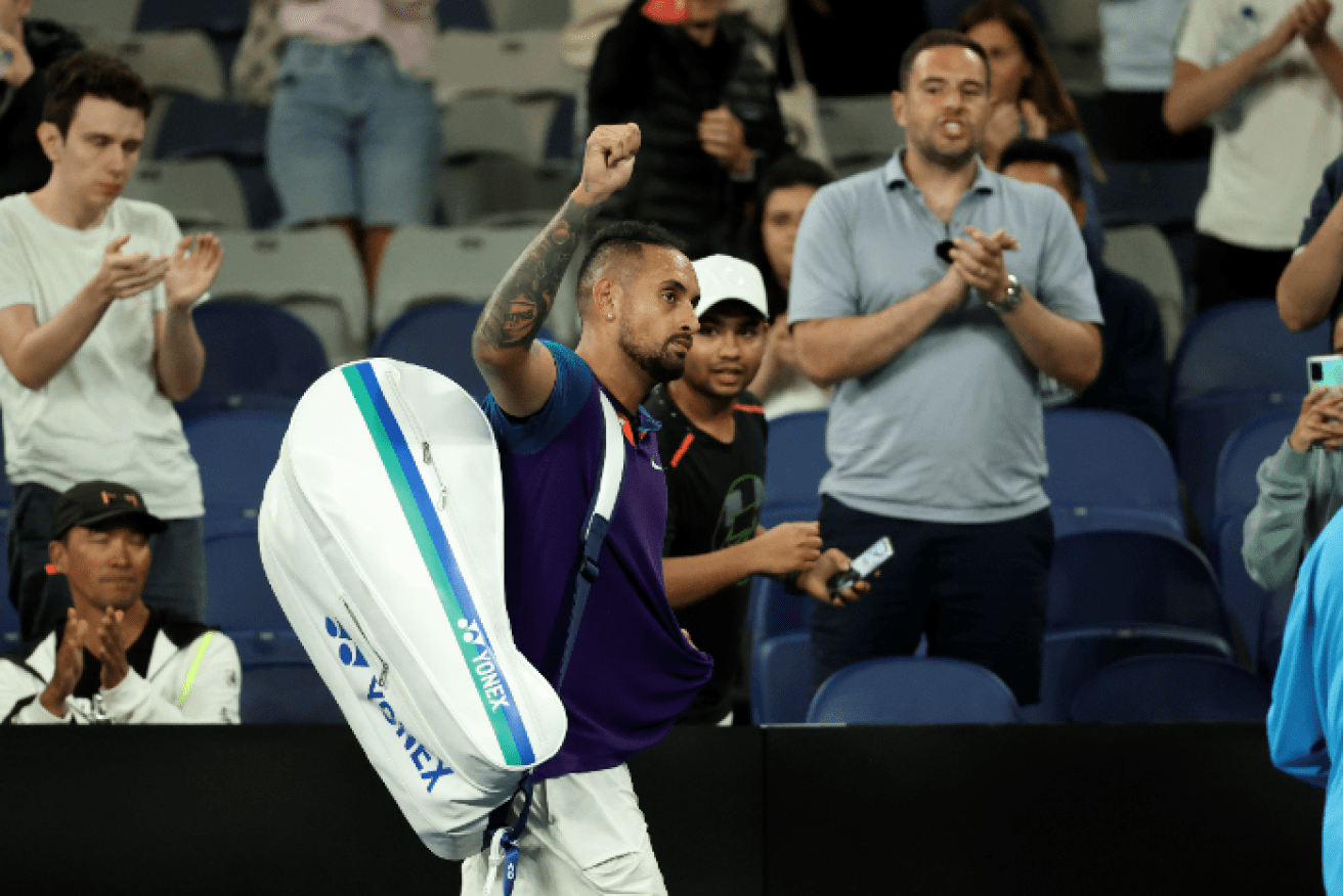 Beaten but unbowed after the three-hour clash, Nick Kyrgios leaves the stadium to the cheers of the crowd.