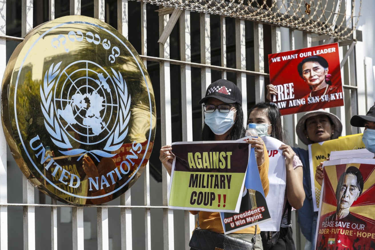 Demonstrators outside the UN office protest against the military coup in Yangon on Tuesday.