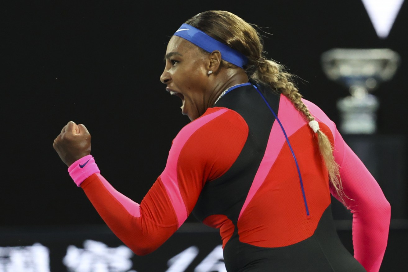 Serena Williams, sporting the multicoloured catsuit she designed herself, gives voice to her killer instinct. <i>Photo:  AAP</i>