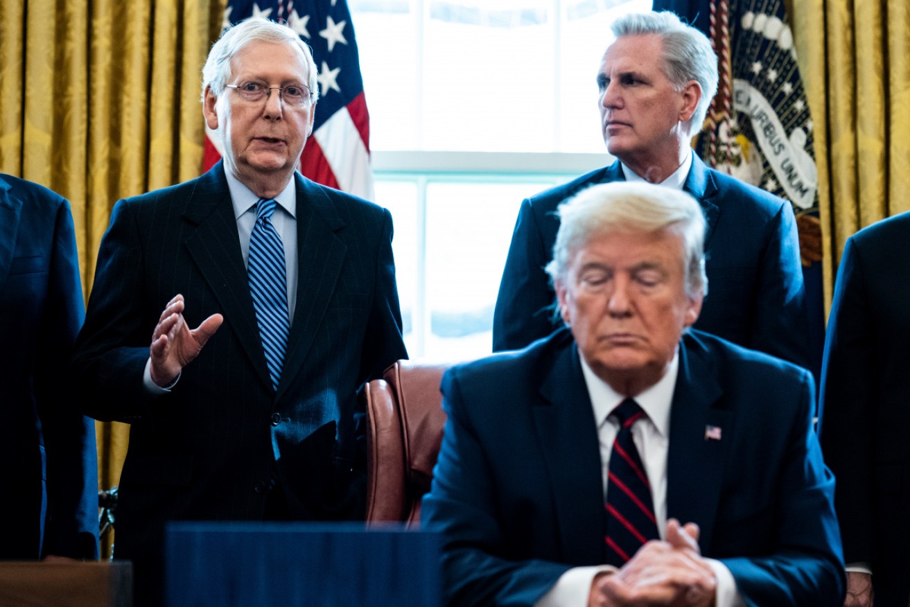 Mr McConnell and Mr Trump in happier times – at an Oval Office ceremony with House Minority Leader Kevin McCarthy in March 2020.
