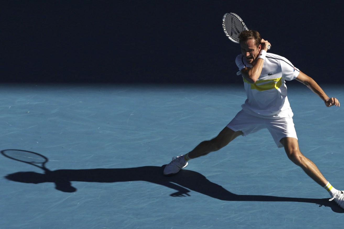 Russia's Daniil Medvedev smashes a forehand to Andrey Rublev on Wednesday.