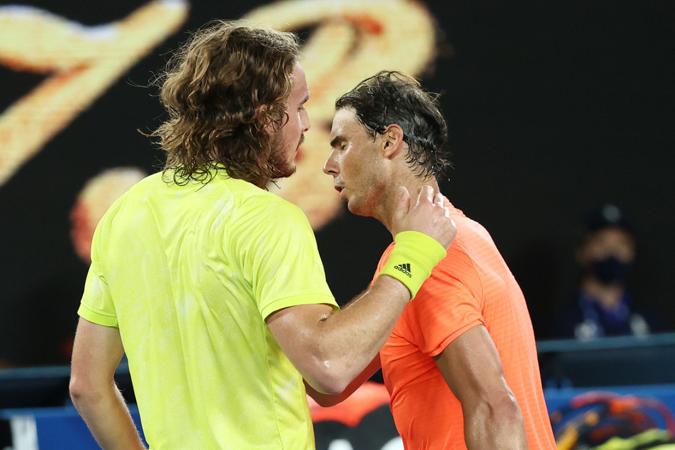 Stefanos Tsitsipas of Greece (L) embraces Rafael Nadal of Spain following victory in his Men’s Singles Quarterfinals match.