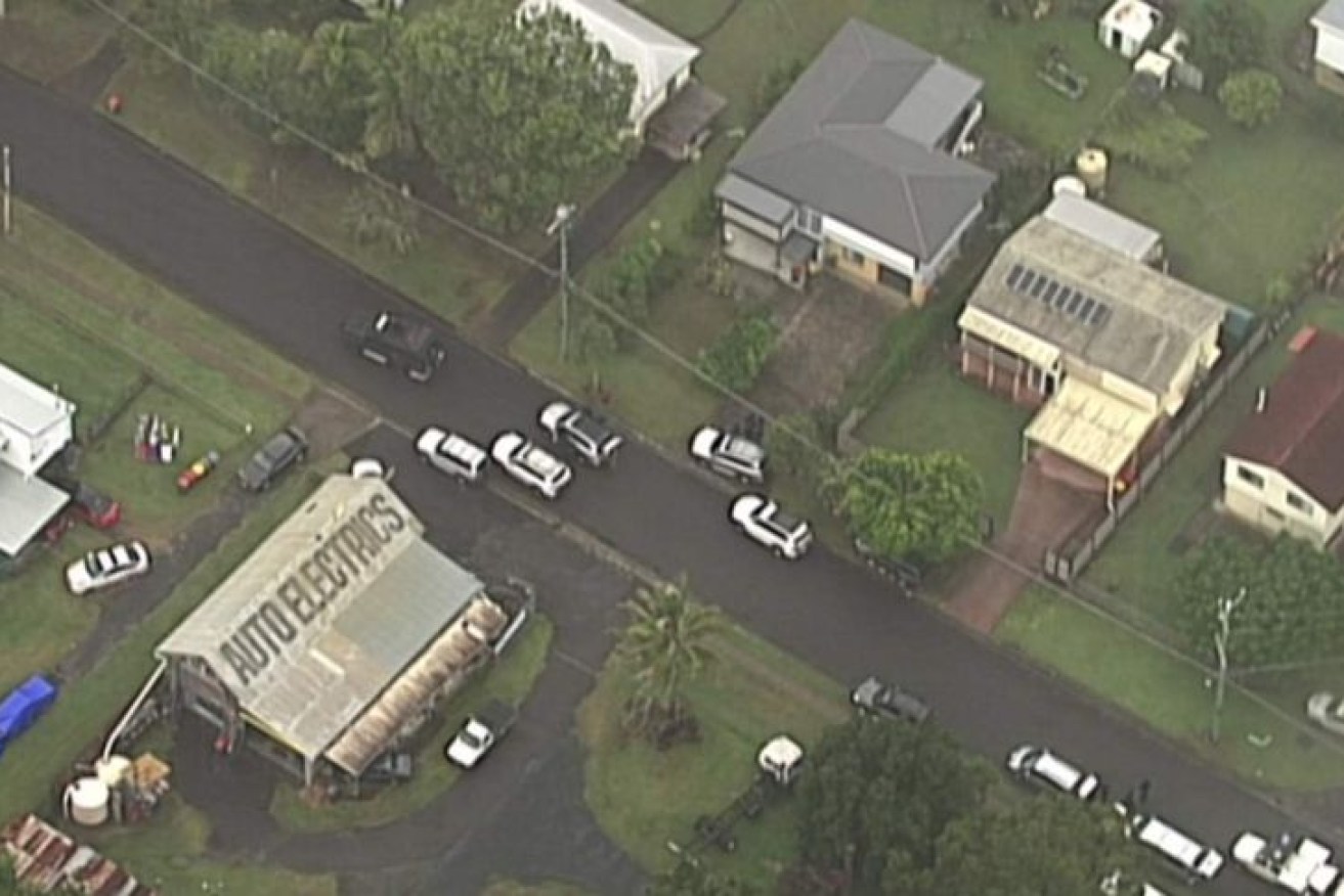 Several police cars involved in the siege on Dyson Avenue in the Brisbane suburb of Sunnybank. 