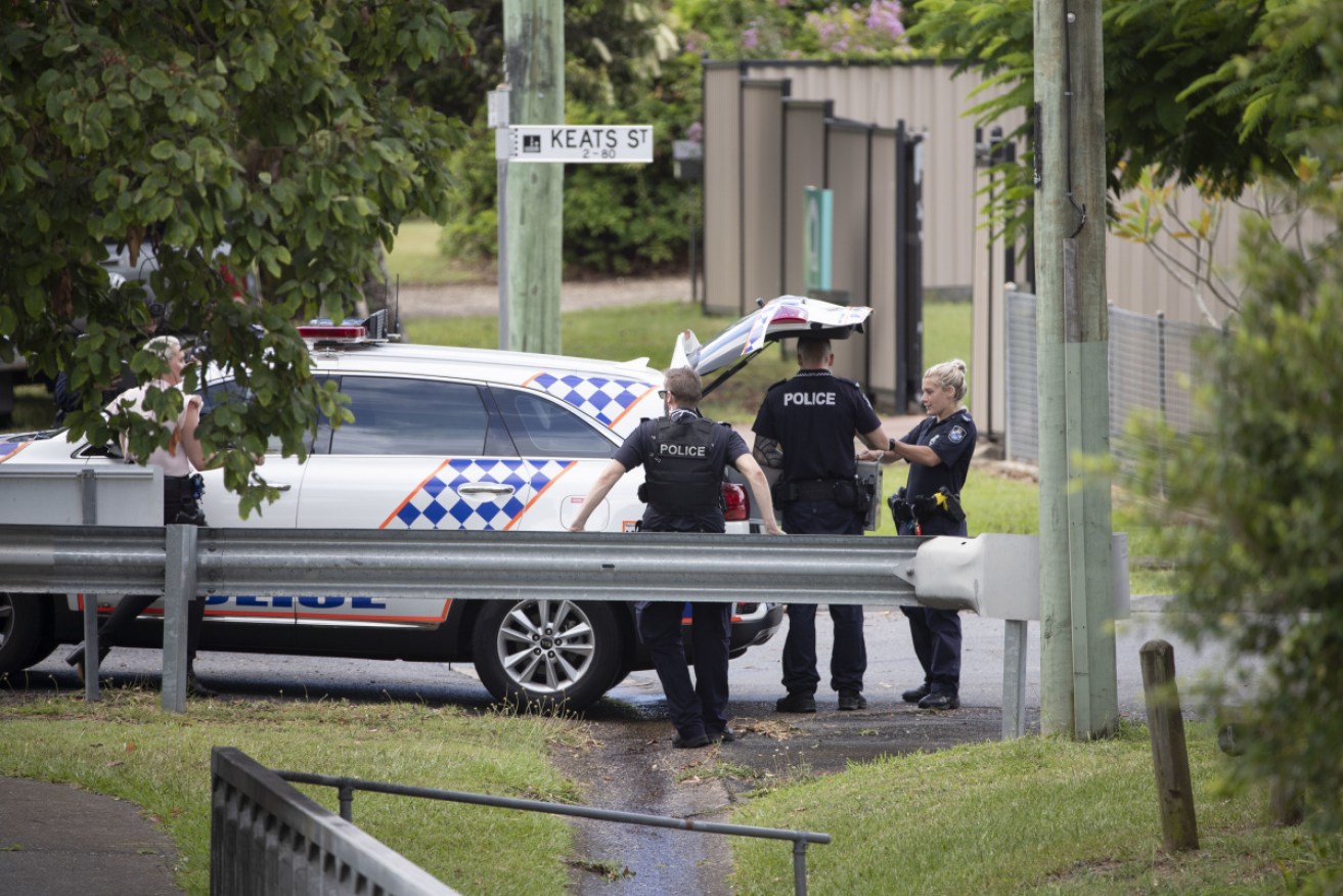 Police at the scene in Brisbane's south, where a stand-off has entered its second day.
