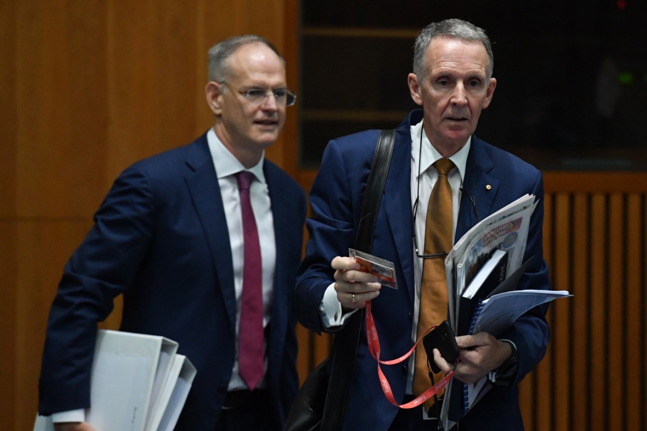 News Corp Australasia group executive Campbell Reid and chief executive Michael Miller arrive for the Senate hearing on Friday.