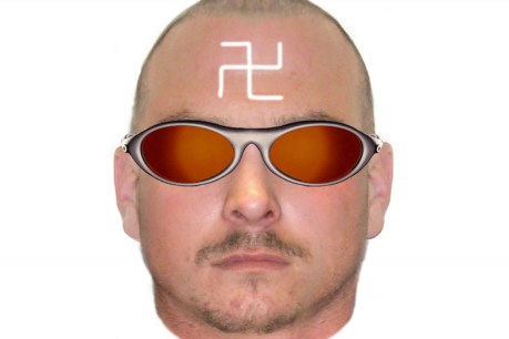 Police hunt swastika-clad man after flame attack
