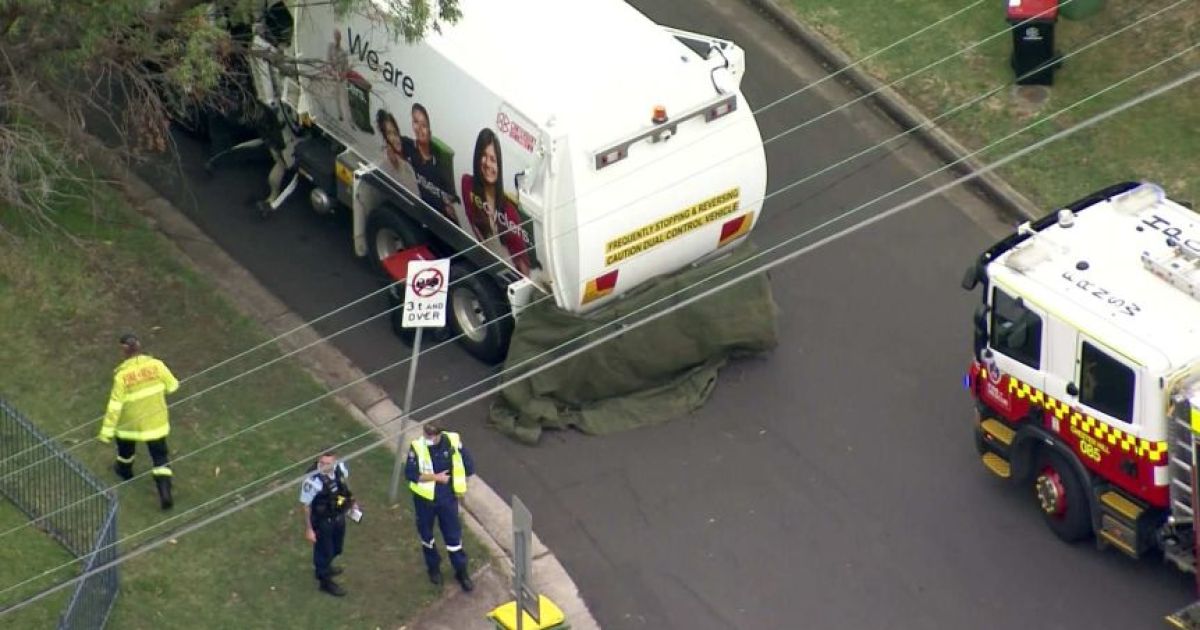 Garbage truck driver charged over death