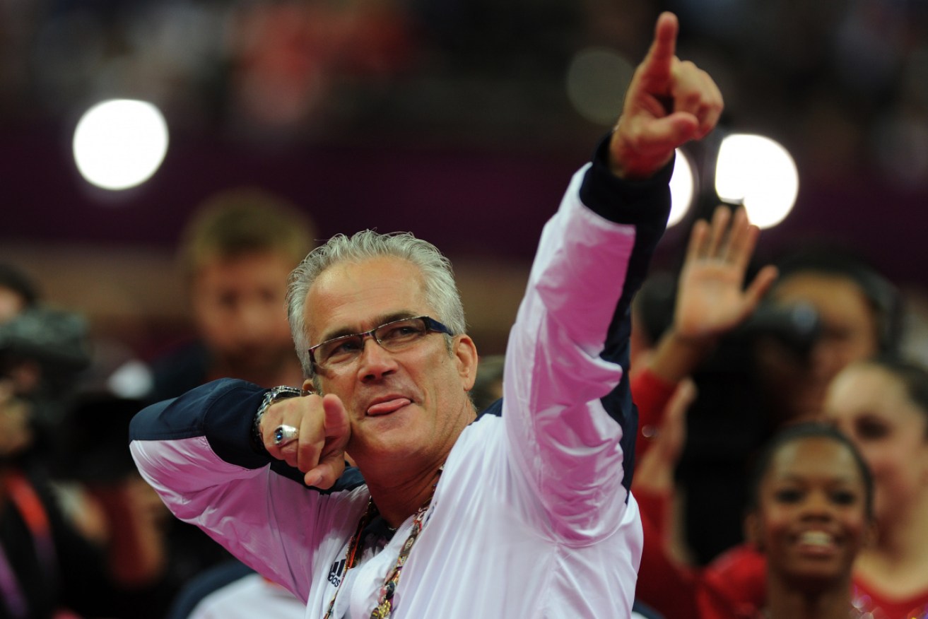 John Geddert celebrates the US women's team's gymnastics gold medal at the London Olympics.