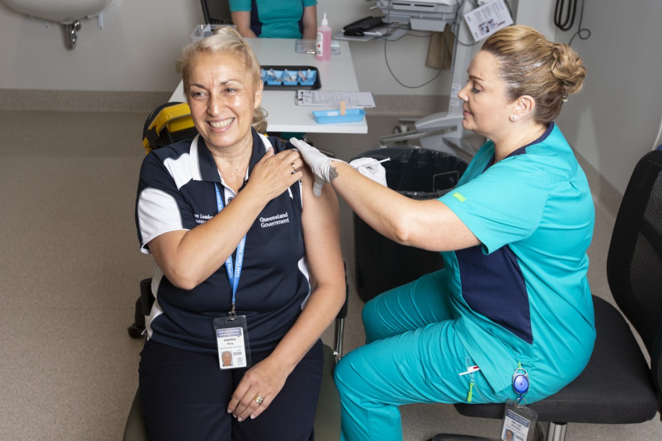 A front-line worker receives her first Pfizer dose at the Gold Coast hospital this week.