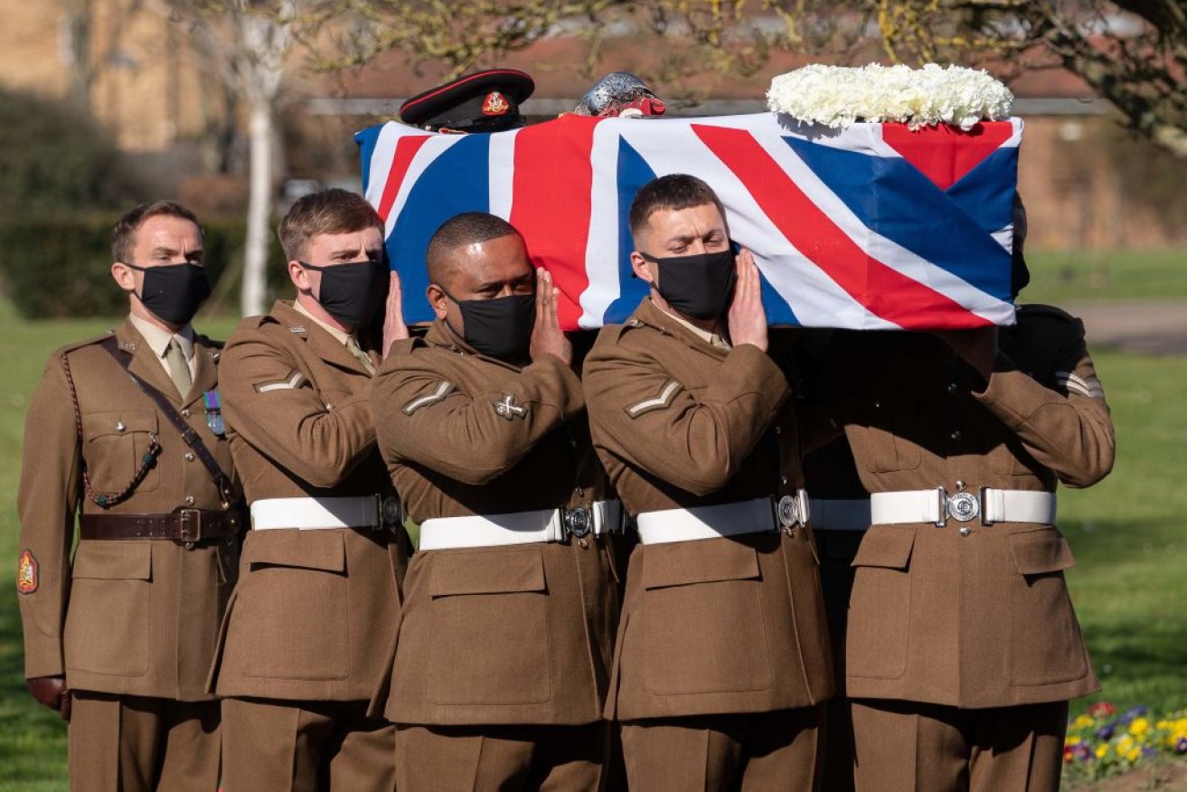 The coffin of Captain Sir Tom Moore is carried by members of the Armed Forces.