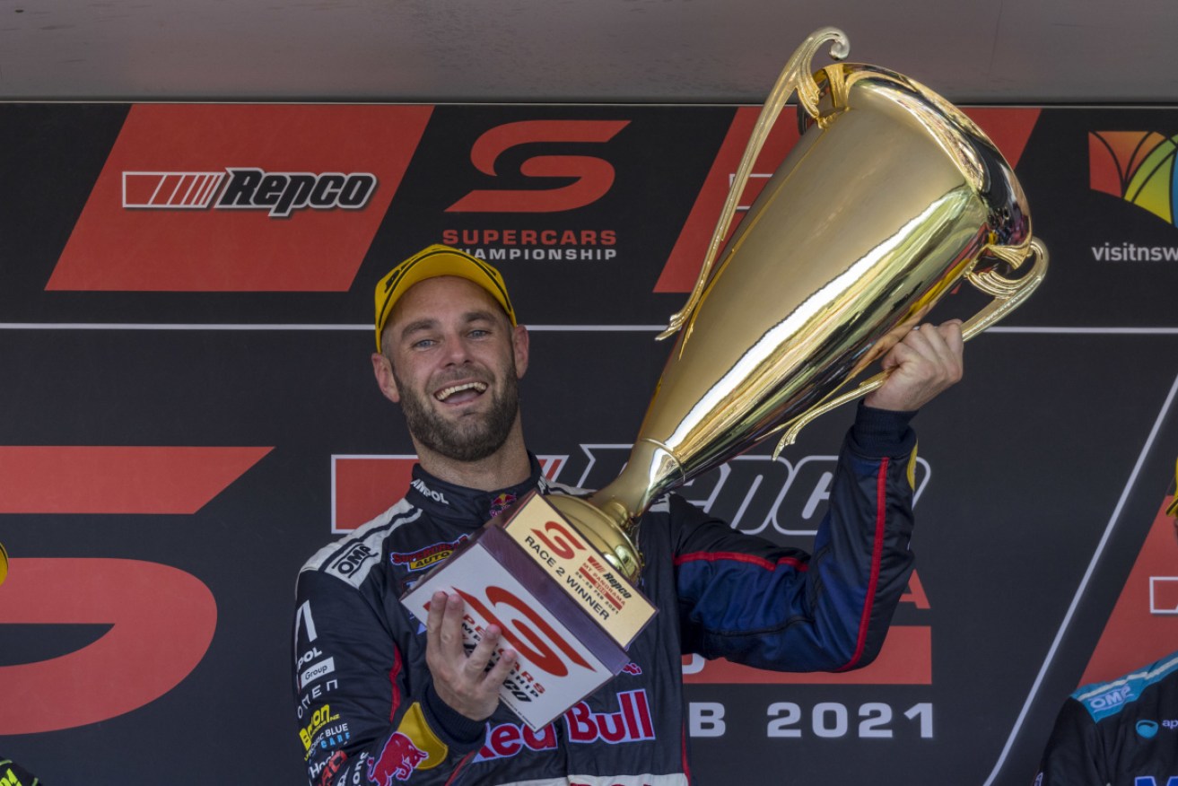 Shane van Gisbergen enjoys the spoils of victory after race two of the Repco Mount Panorama 500 on Sunday.